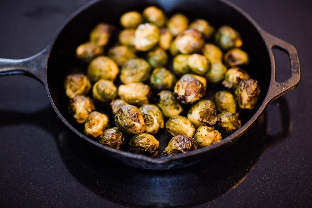 Cast Iron Brussel Sprouts with Bacon, Sage and Cedar Candied Pecans