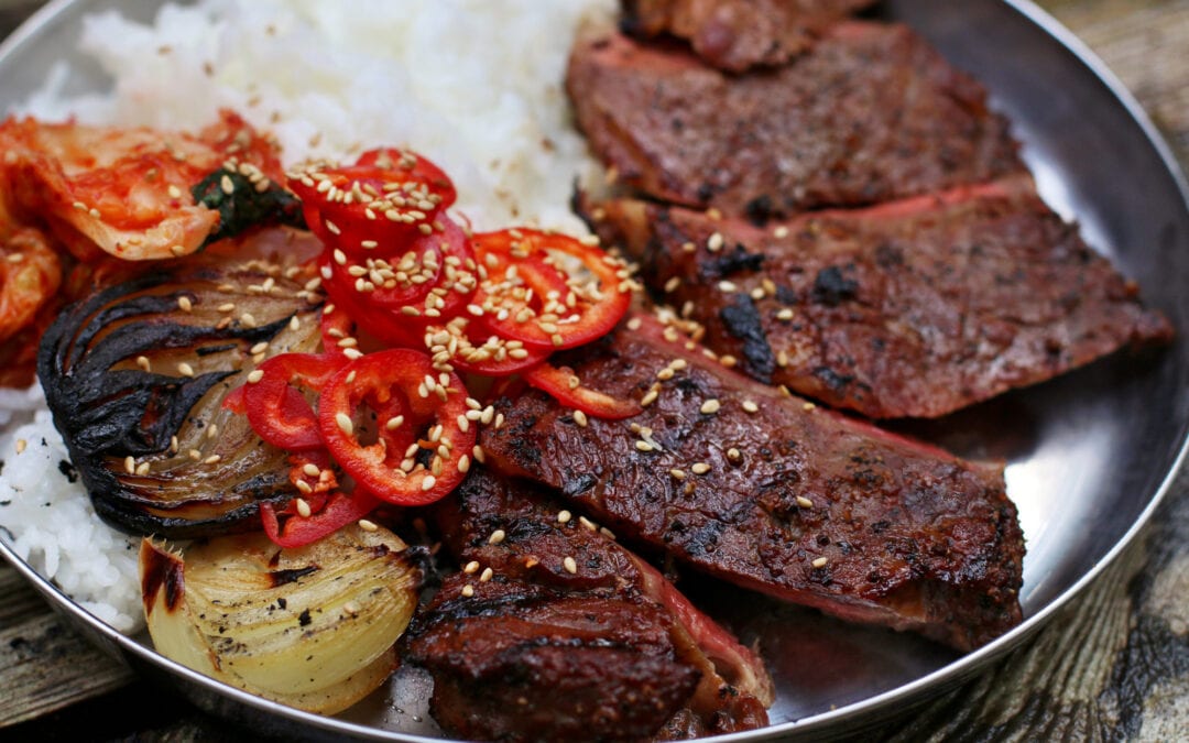 Cedar Planked Kalbi Marinated Steaks with Charred Onions